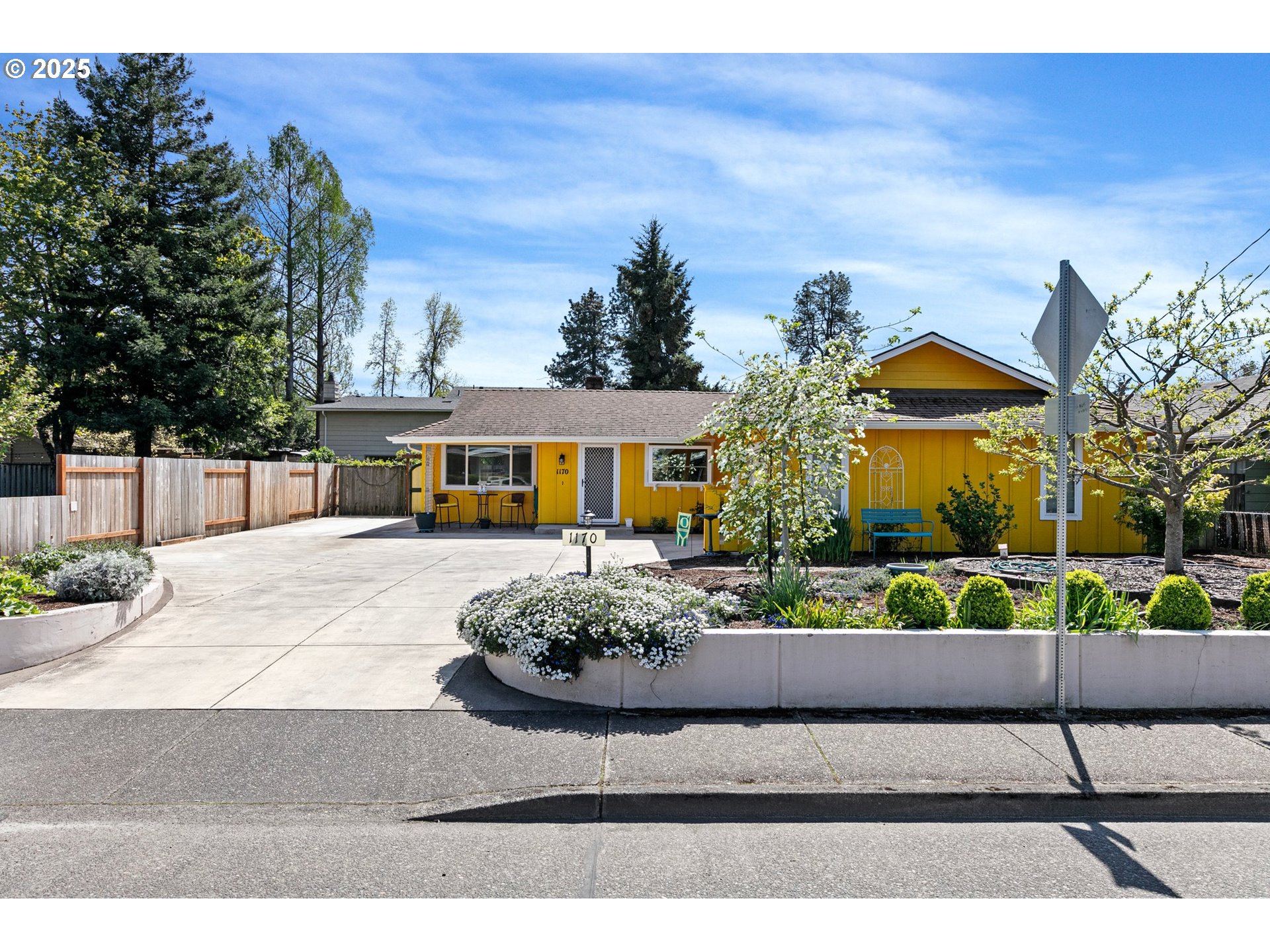 1170 Cal Young Road Eugene, OR 97401 - Photo 3 of 40 a front view of a house with a garden
