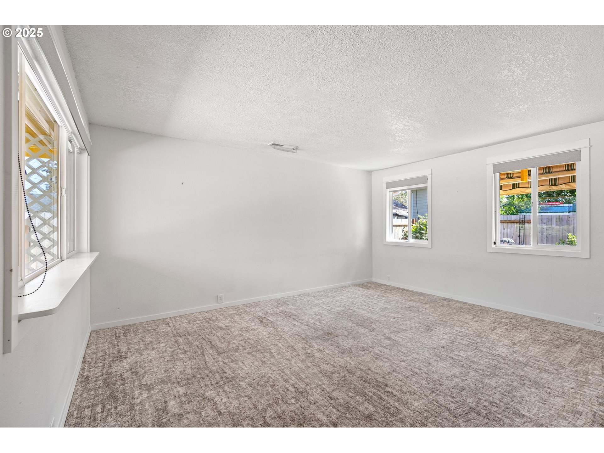 1170 Cal Young Road Eugene, OR 97401 - Photo 35 of 40 an empty room with windows