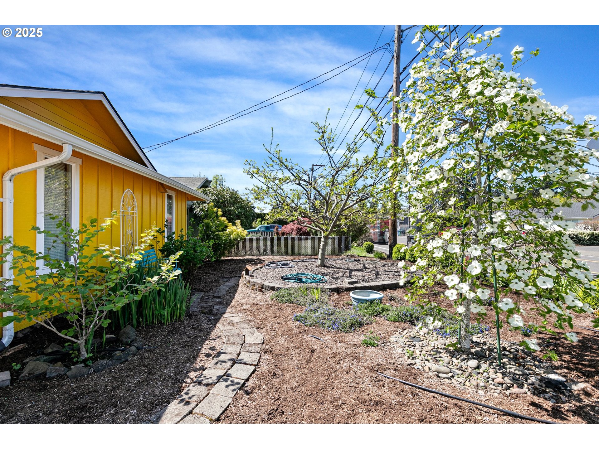 1170 Cal Young Road Eugene, OR 97401 - Photo 40 of 40 a backyard of a house with plants and outdoor seating