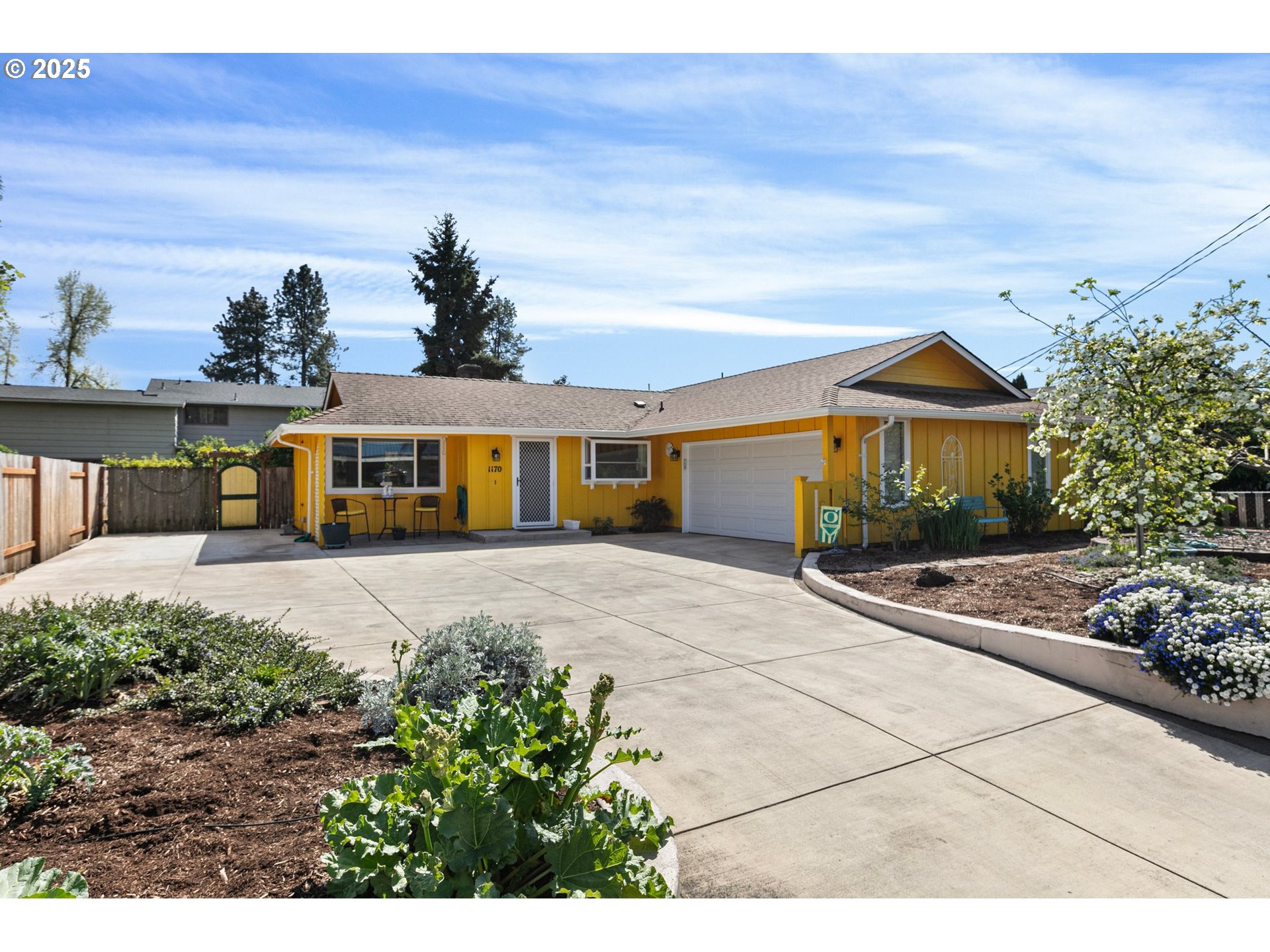 1170 Cal Young Road Eugene, OR 97401 - Photo 4 of 40 a front view of a house with a yard