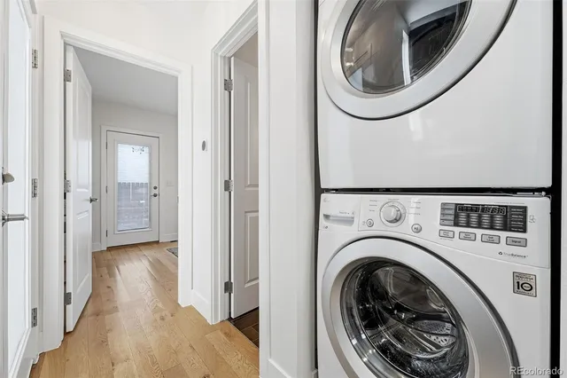 a view of a hallway with washer and dryer