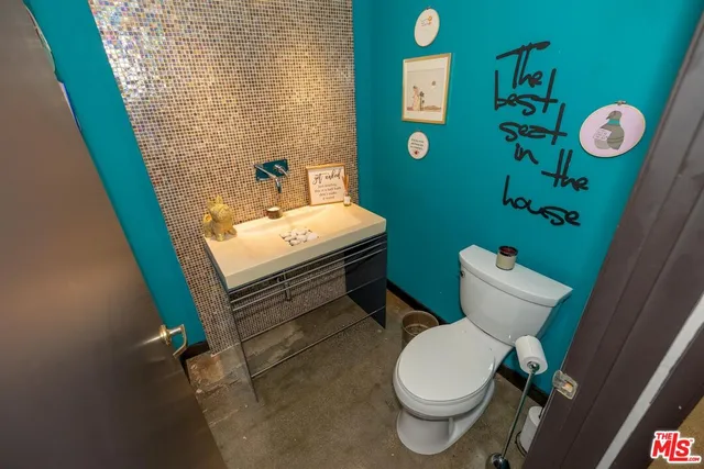 a view of a chairs and table on the balcony