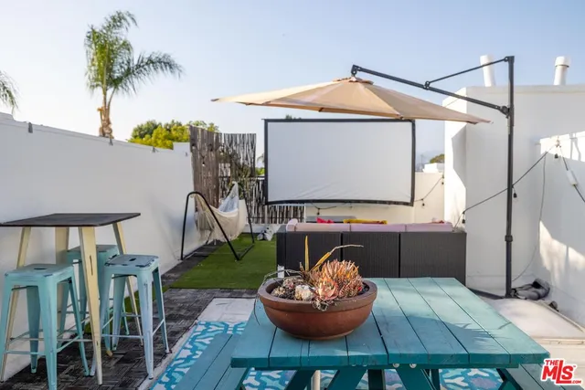 a room with furniture and a potted plant
