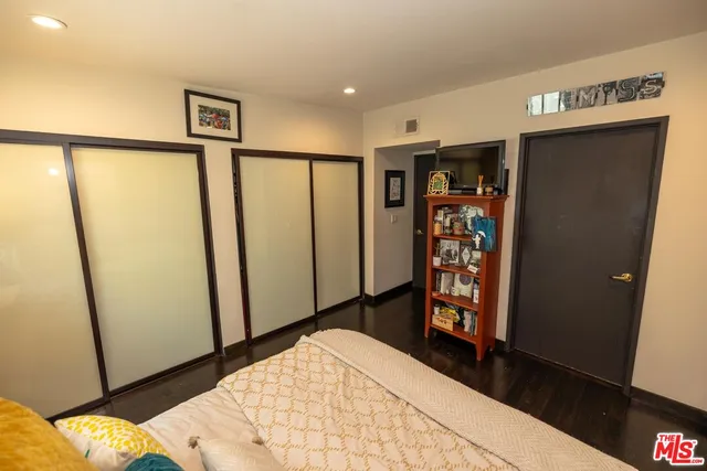 a kitchen with stainless steel appliances a refrigerator a stove a microwave and cabinets