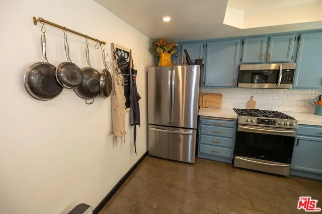 a living room with furniture a chandelier