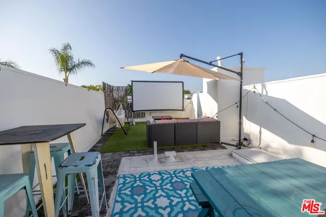 a bedroom with furniture and wooden floor