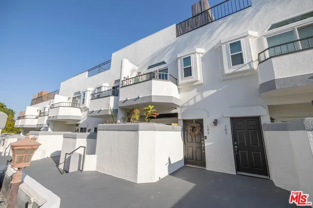 a backyard of a house with seating space