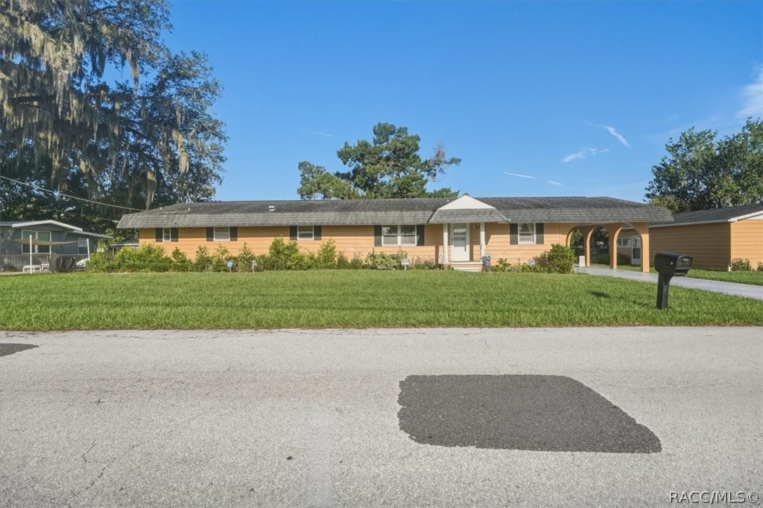 928 South Shad Terrace Inverness, FL 34450 - Photo 27 of 48 a view of house with outdoor space and parking