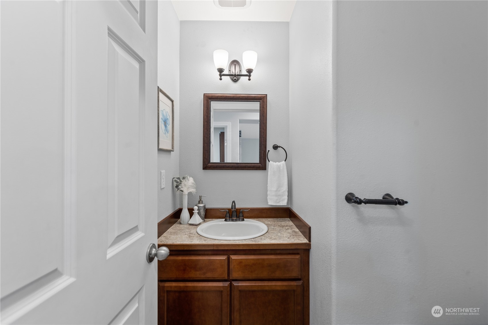 306 South Lake Roesiger Road Snohomish, WA 98290 - Photo 16 of 40 a bathroom with a sink and a mirror
