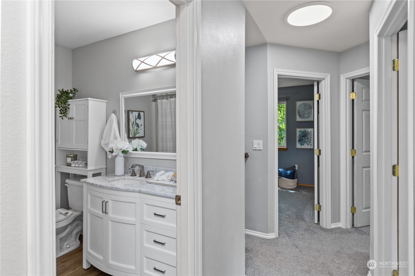 306 South Lake Roesiger Road Snohomish, WA 98290 - Photo 28 of 40 a bathroom with a double vanity sink and mirror