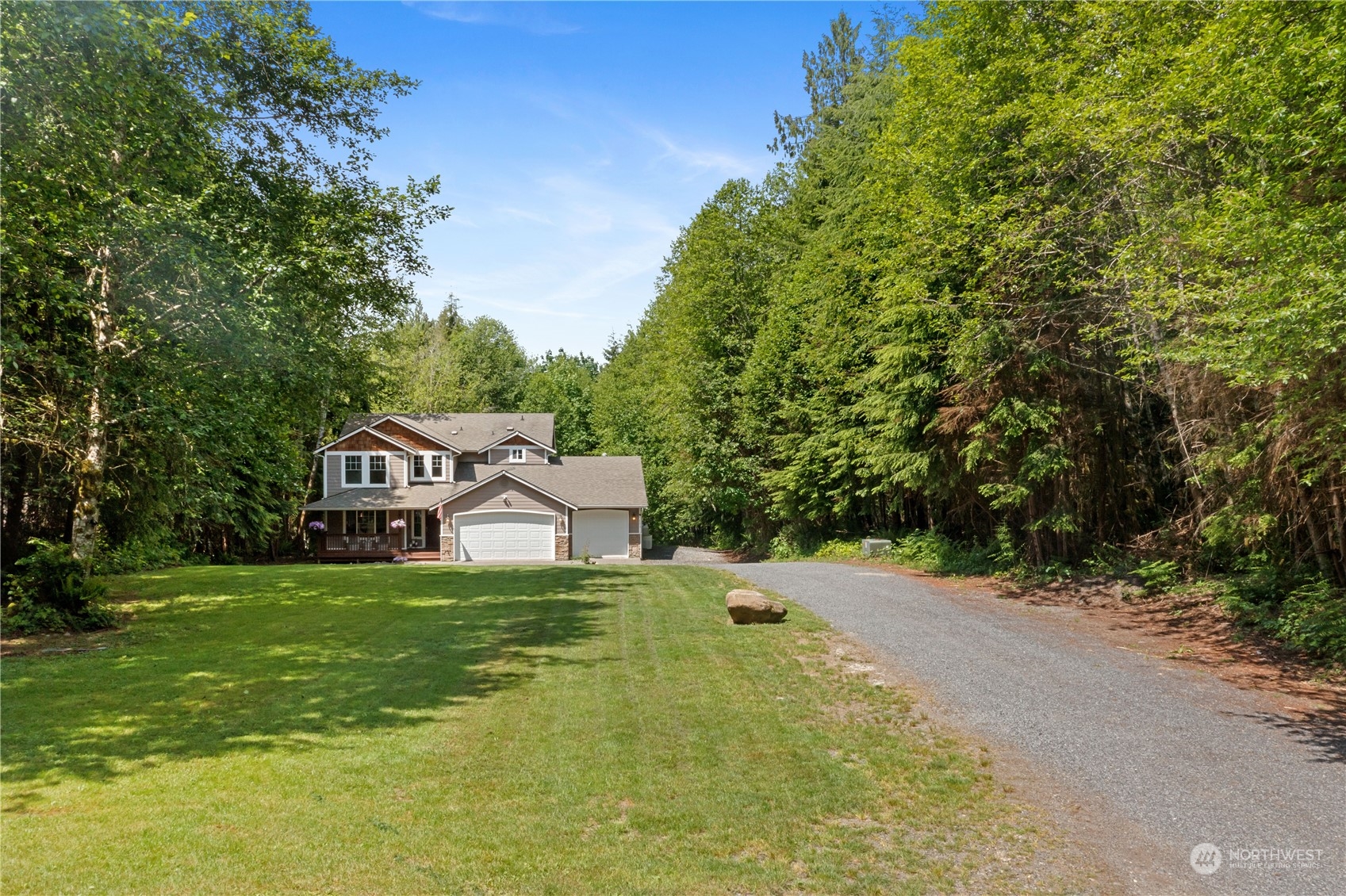 306 South Lake Roesiger Road Snohomish, WA 98290 - Photo 33 of 40 a white house with a big yard and large trees
