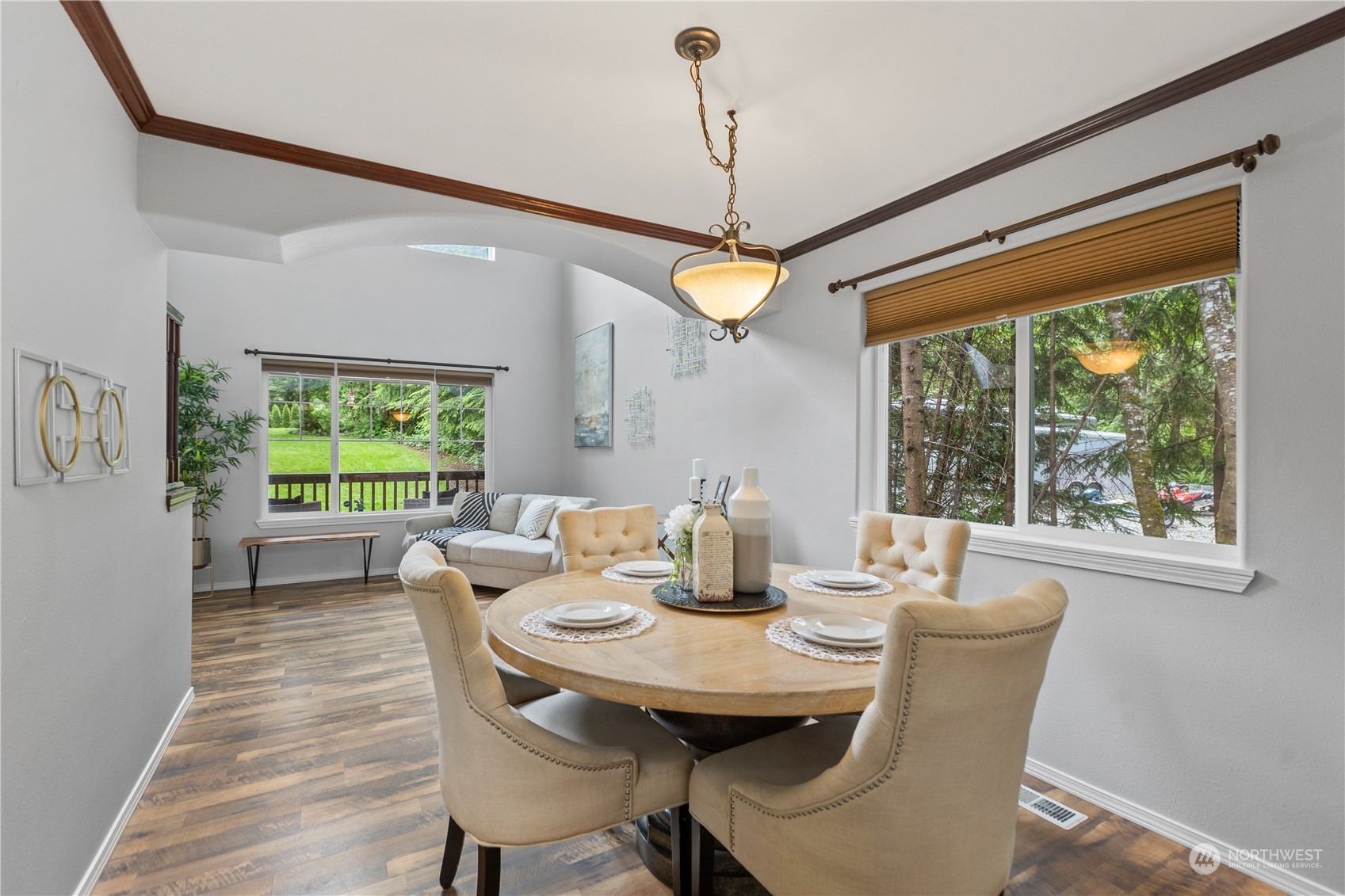 306 South Lake Roesiger Road Snohomish, WA 98290 - Photo 8 of 40 a dining room with furniture a chandelier and wooden floor