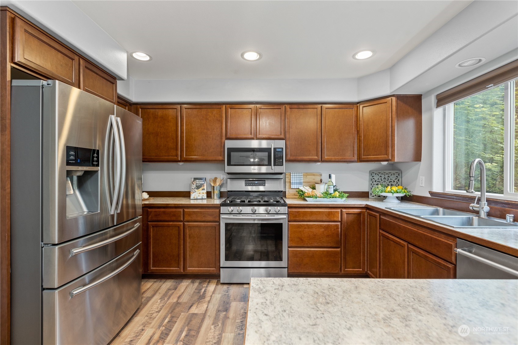 306 South Lake Roesiger Road Snohomish, WA 98290 - Photo 10 of 40 a kitchen with stainless steel appliances granite countertop a refrigerator sink and stove