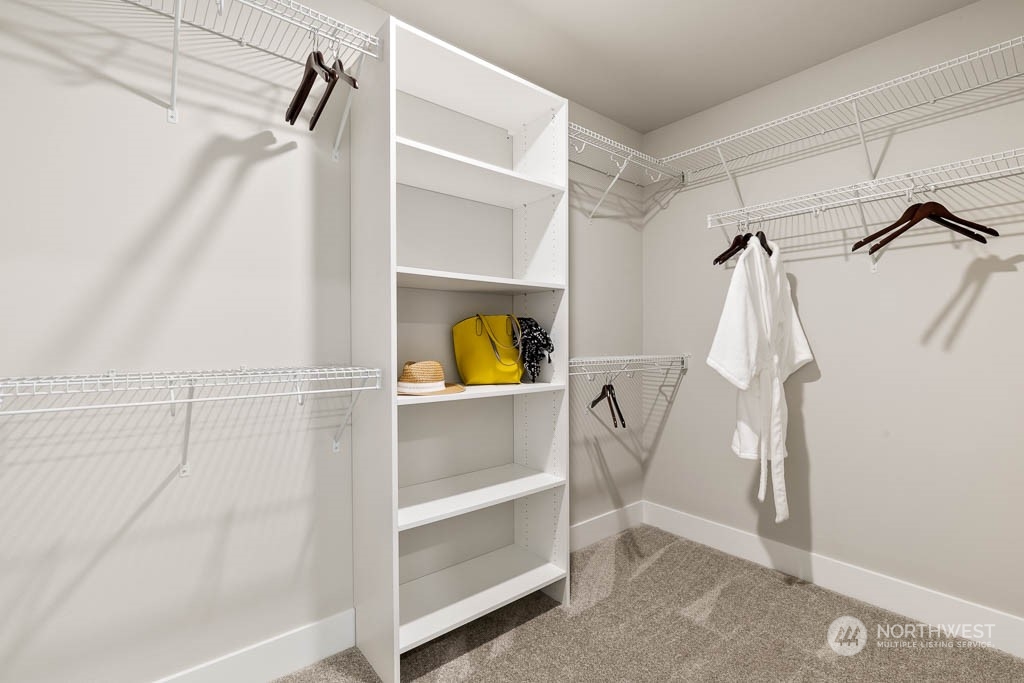 22903 20th Place West Bothell, WA 98021 - Photo 26 of 32 a view of walk in closet with empty racks
