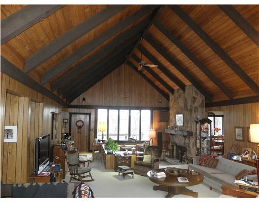 1255 Country Club Road Monongahela, PA 15063 - Photo 2 of 18 Great Room. Majestic Soaring Cedar Ceilings in Huge 20x40 Great Room w/ 14x13 Sunken Conversation Pit featuring Log Burning Stone Fireplace.<BR/>Also built-in desk & wet bar & door to deck!