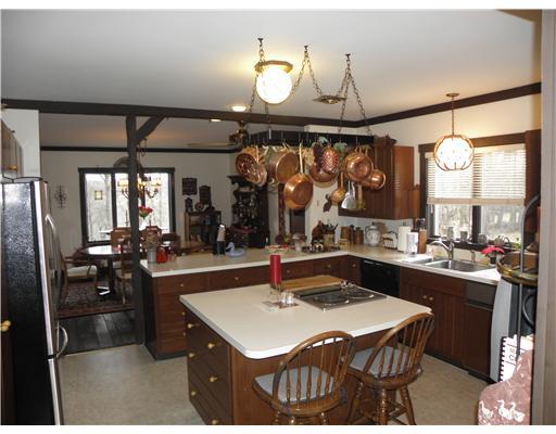 1255 Country Club Road Monongahela, PA 15063 - Photo 4 of 18 Kitchen. Spacious Kitchen w/ Newer Appliances & Convenient Kitchen Island w/ Seats and Built-in Cook Top. Huge Walk-in Pantry plus Oak Pull-out Pantry. Also, 2nd Grill & Griddle Cook Top w/ Built-in Exhaust.