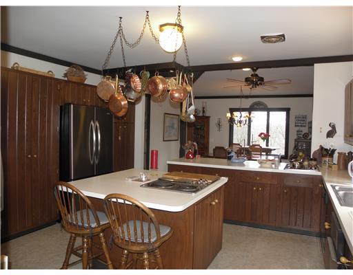 1255 Country Club Road Monongahela, PA 15063 - Photo 7 of 18 Kitchen. Open Eat-in Kitchen w/ Newer Appliances including Refrigerator, Electric Oven, 2 Convenient Cook Tops, Dishwasher, Microwave, Trash Compactor & Garbage Disposal are all added features to this Dream Kitchen