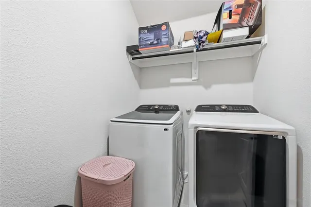 a utility room with dryer and washer