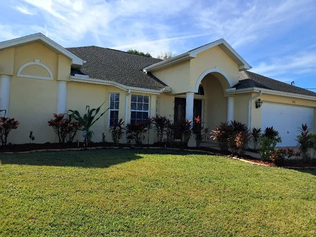 front view of a house with a yard