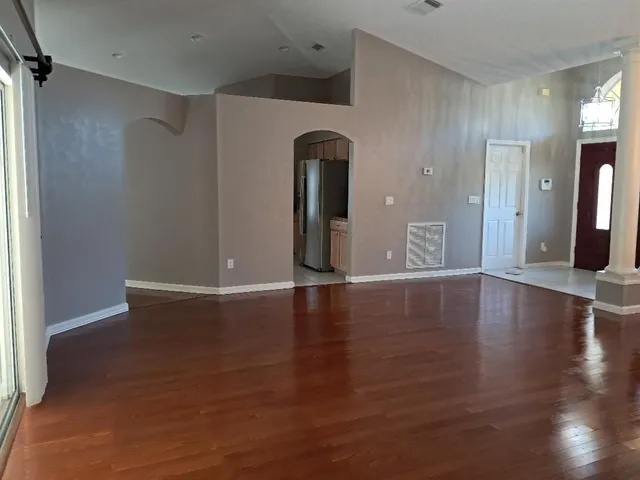 a kitchen with stainless steel appliances granite countertop a refrigerator and a stove
