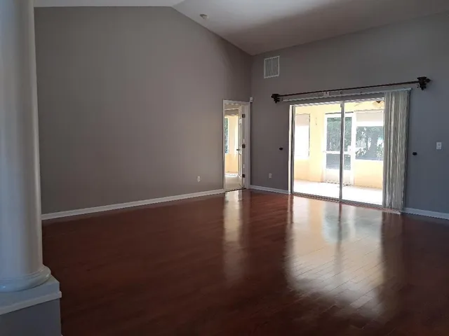 a kitchen with granite countertop a sink stove and cabinets