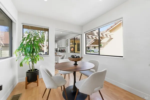 a dining room with furniture and window