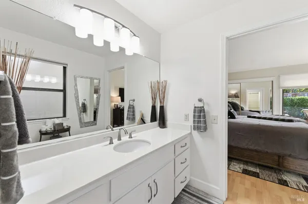 a en suite bathroom with double sink and a mirror