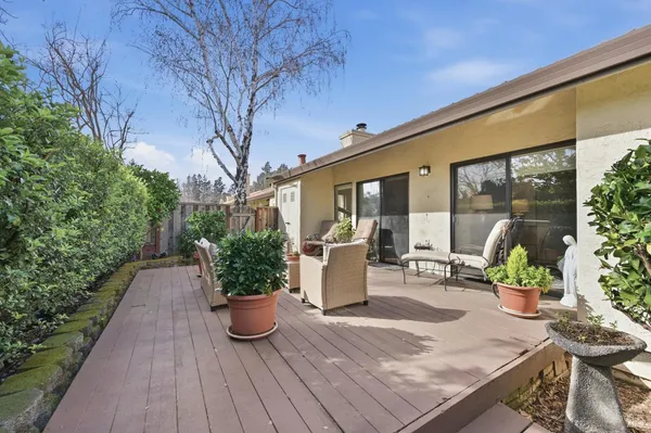 a view of a chairs and table in patio