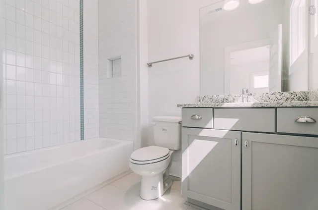 a bathroom with a toilet a sink and bathtub