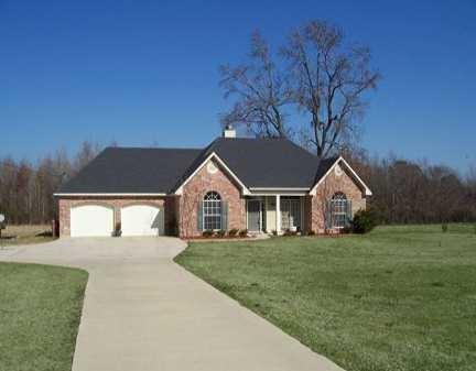 284 Collinswood Road Stonewall, LA 71078 - Photo 1 of 1 Single story home featuring a front lawn, driveway, and an attached garage