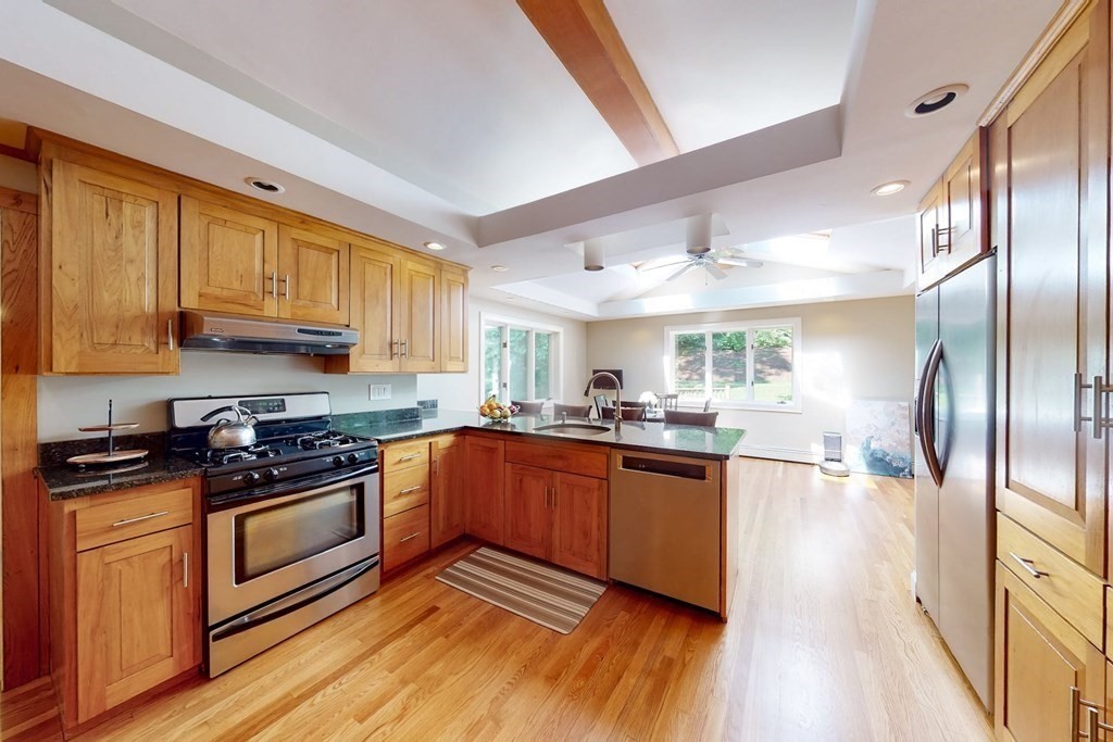11 Stagecoach Road Medfield, MA 02052 - Photo 11 of 38 a kitchen with stainless steel appliances granite countertop a stove a sink dishwasher and a refrigerator