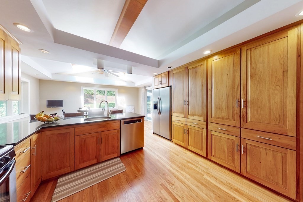 11 Stagecoach Road Medfield, MA 02052 - Photo 13 of 38 a large kitchen with stainless steel appliances wooden floor and large window