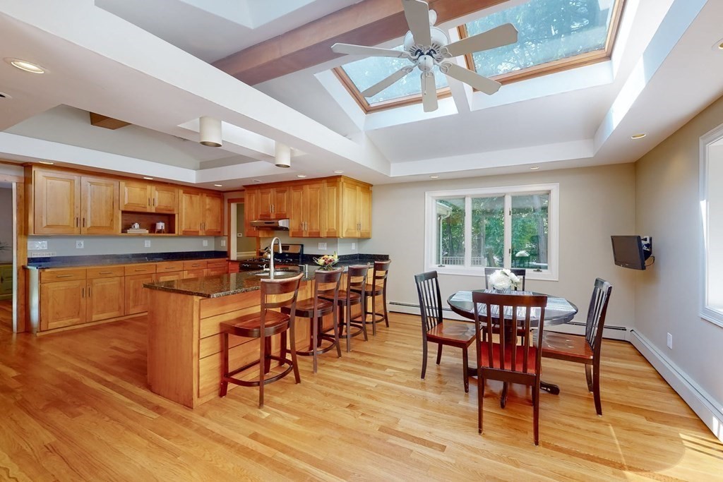 11 Stagecoach Road Medfield, MA 02052 - Photo 14 of 38 a view of a dining room with furniture window and wooden floor