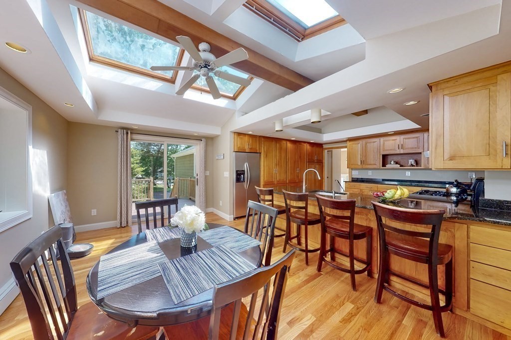 11 Stagecoach Road Medfield, MA 02052 - Photo 15 of 38 a view of a dining room with furniture window and wooden floor