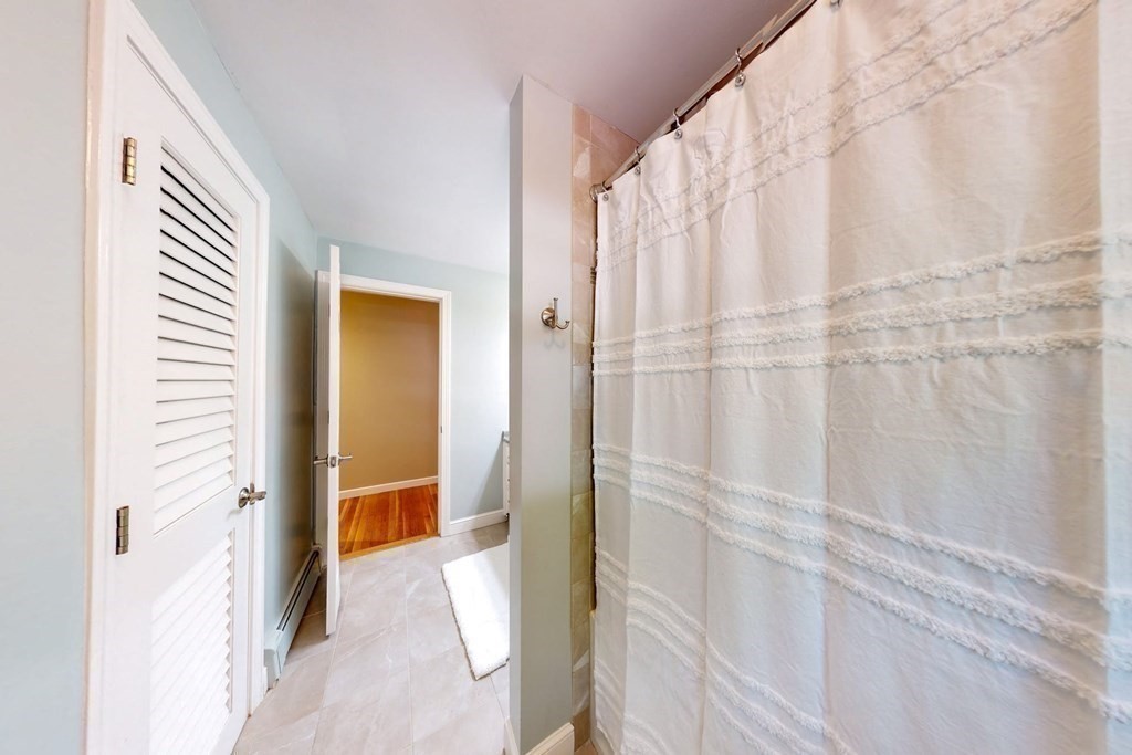 11 Stagecoach Road Medfield, MA 02052 - Photo 24 of 38 a bathroom with a shower and a tub