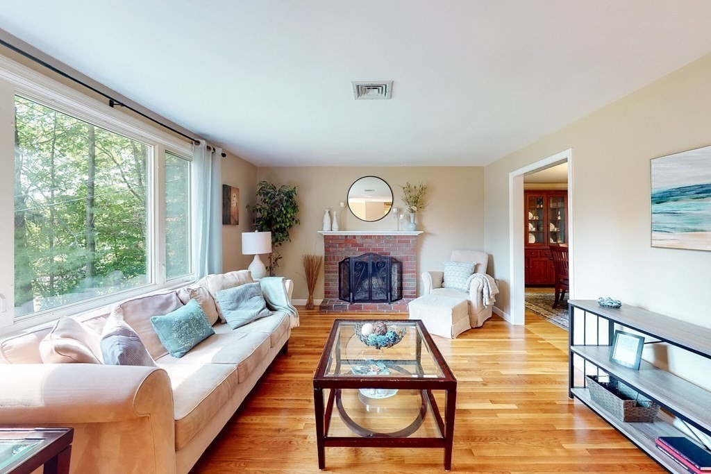 11 Stagecoach Road Medfield, MA 02052 - Photo 3 of 38 a living room with furniture and a fireplace