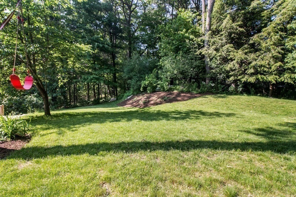 11 Stagecoach Road Medfield, MA 02052 - Photo 34 of 38 a backyard of a house with a yard and outdoor seating