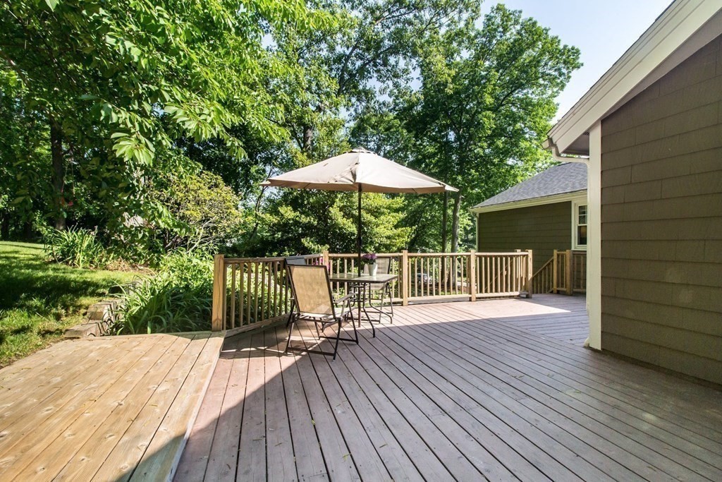 11 Stagecoach Road Medfield, MA 02052 - Photo 38 of 38 a balcony with wooden floor table and chairs