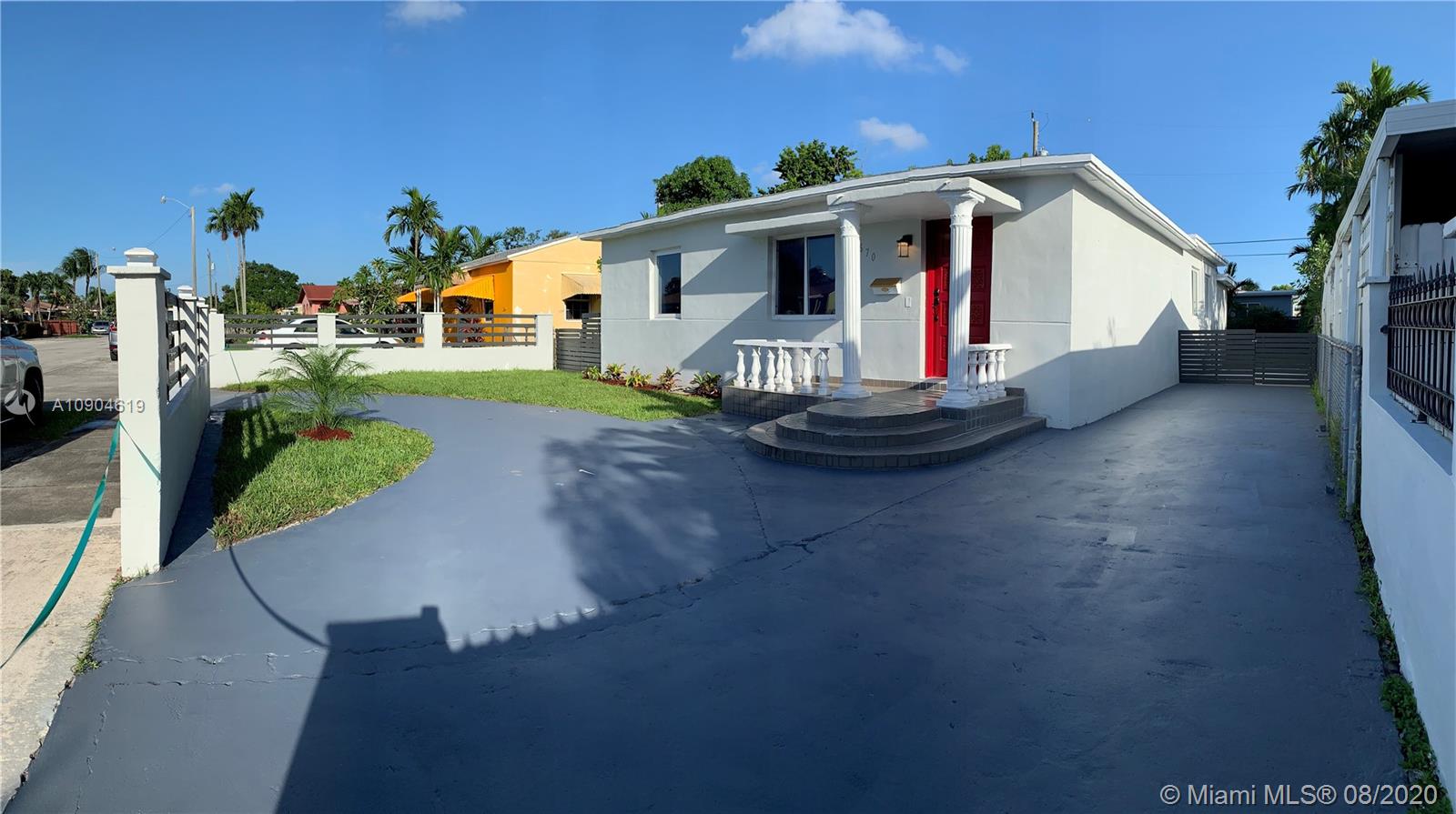 3670 Northwest 16th Street Miami, FL 33125 - Photo 2 of 17 a front view of a house with a yard