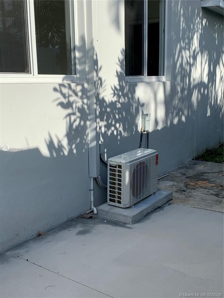 3670 Northwest 16th Street Miami, FL 33125 - Photo 14 of 17 a view of a door front of a house