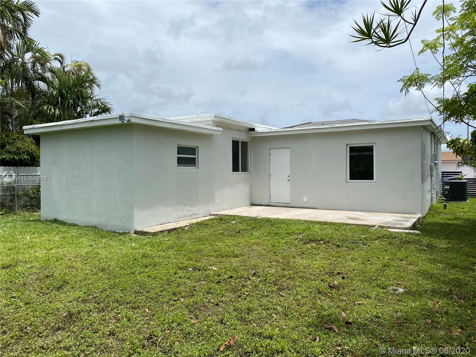 3670 Northwest 16th Street Miami, FL 33125 - Photo 17 of 17 a house with a yard