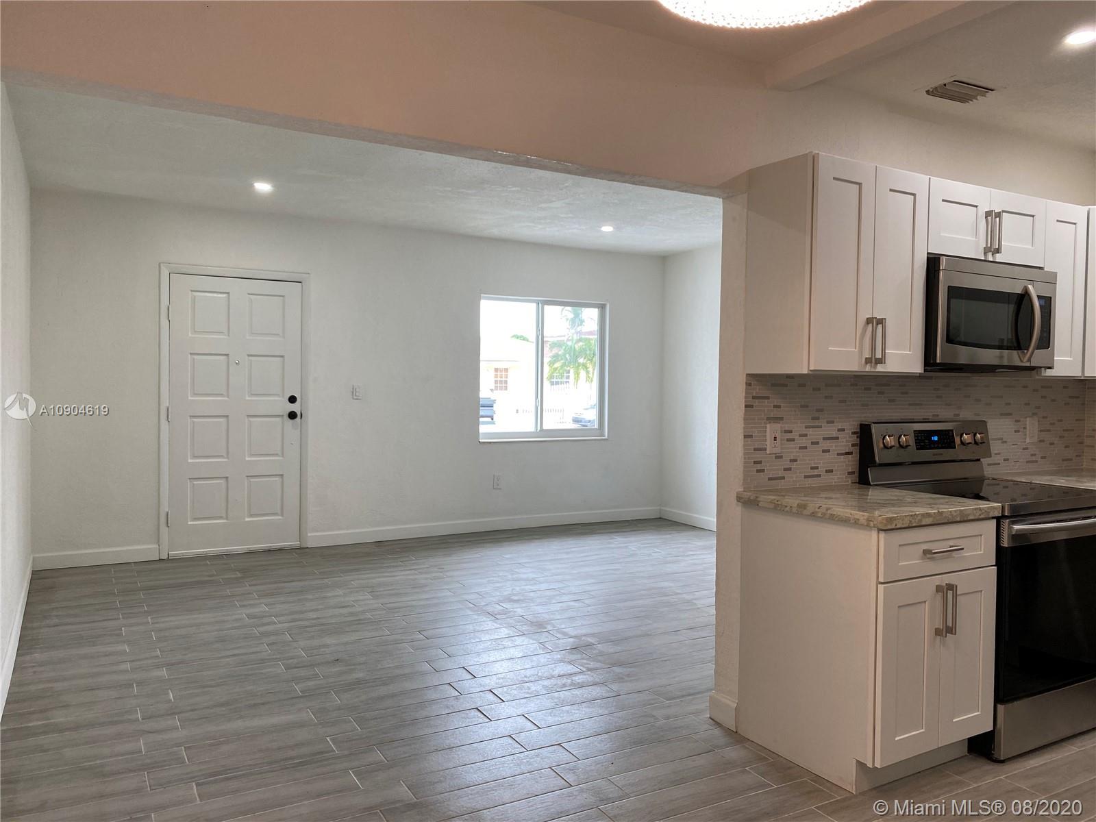 3670 Northwest 16th Street Miami, FL 33125 - Photo 3 of 17 a view of a kitchen with electric appliances
