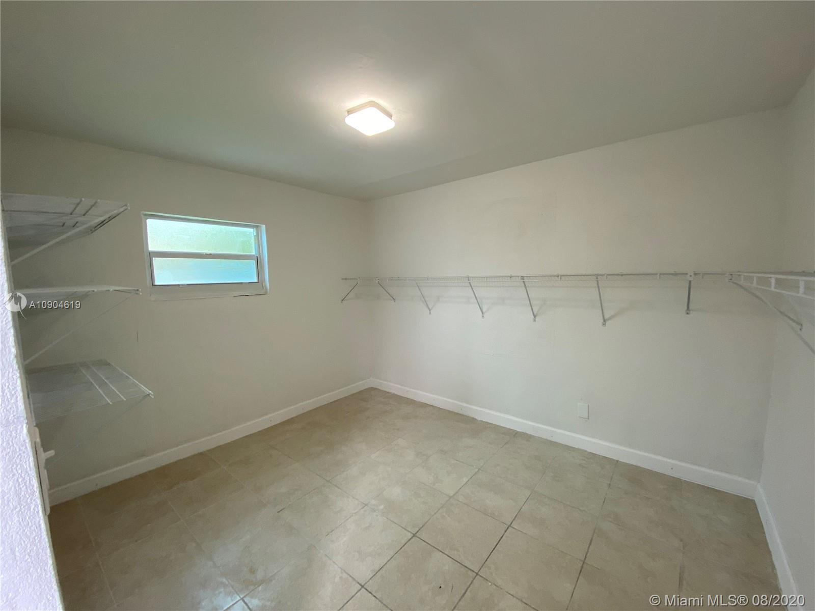 3670 Northwest 16th Street Miami, FL 33125 - Photo 8 of 17 an empty room with a workbench