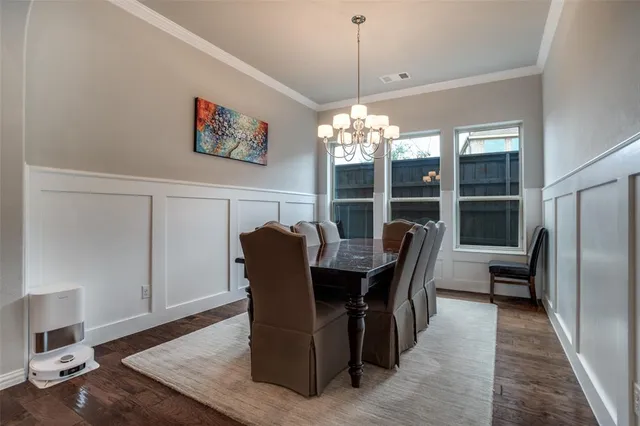 a kitchen with stainless steel appliances a sink and a refrigerator