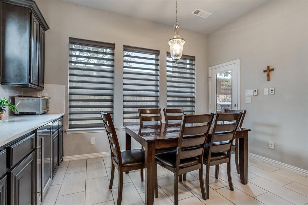 3410 Challis Trail McKinney, TX 75070 - Photo 14 of 31 a dining room with furniture and window