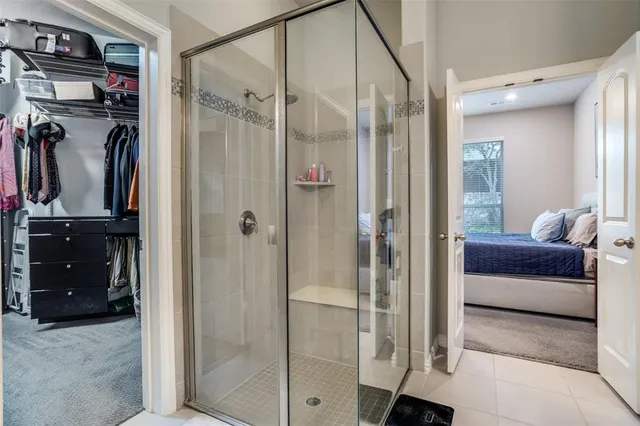 a spacious bathroom with a sink double vanity and a mirror