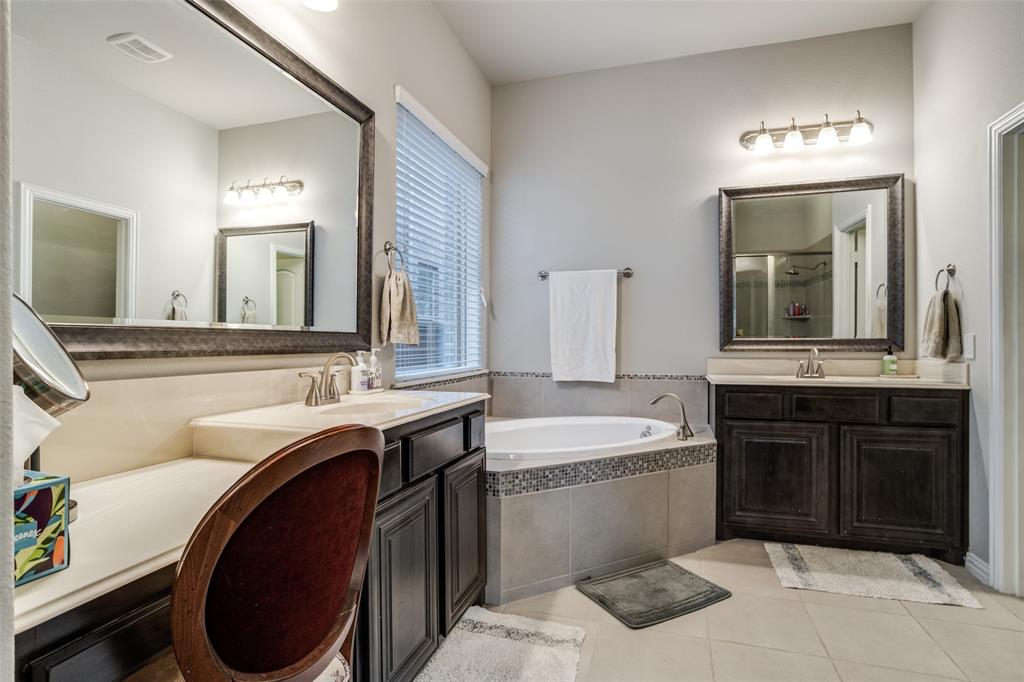 3410 Challis Trail McKinney, TX 75070 - Photo 17 of 31 a spacious bathroom with a sink double vanity and a mirror