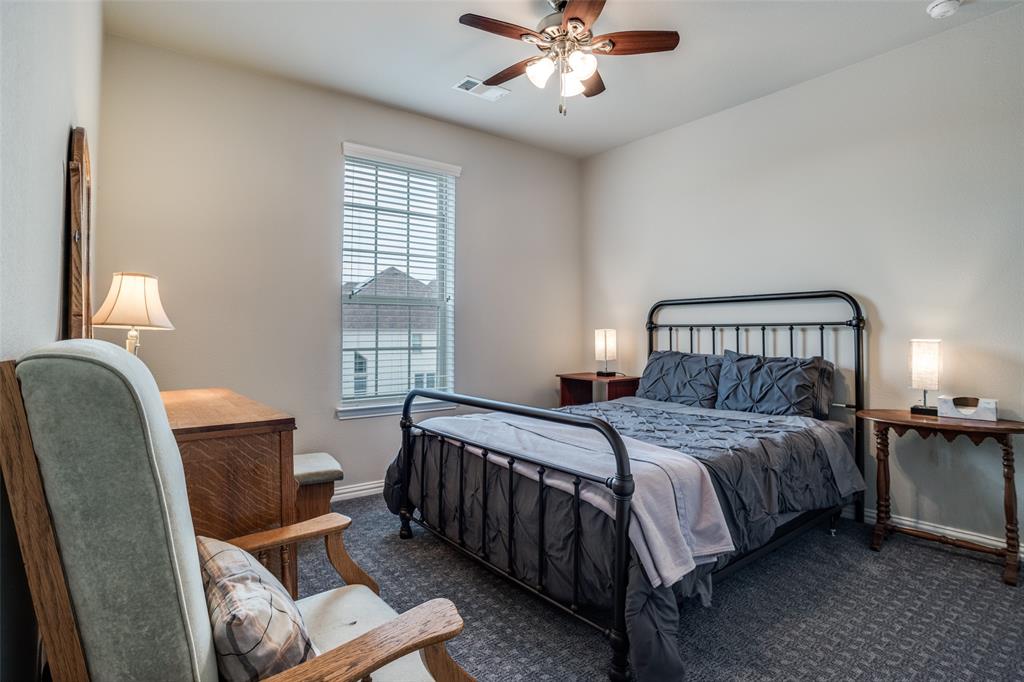 3410 Challis Trail McKinney, TX 75070 - Photo 23 of 31 a bedroom with a bed chairs and window