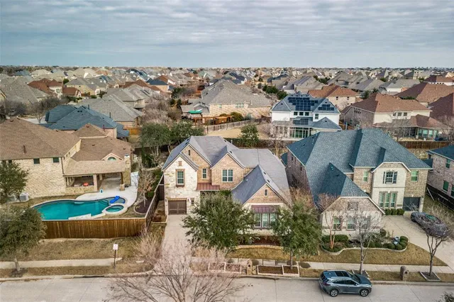 a view of a swimming pool with a yard