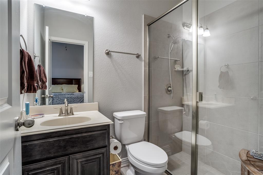 3410 Challis Trail McKinney, TX 75070 - Photo 9 of 31 a bathroom with a sink toilet and shower
